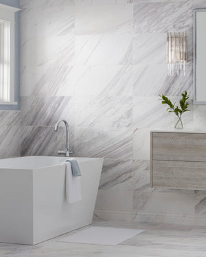 Close-up of the Wallis Wall Sconce in polished nickel showing the arm curve and shade silhouette.