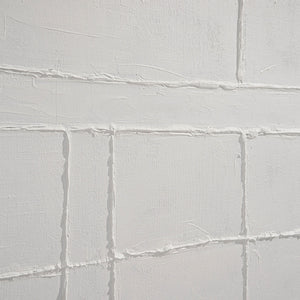 Medea Wall Art featuring a textured white surface with raised grid patterns and subtle brush strokes.