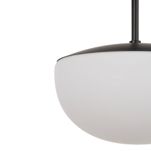 Close-up of Aditi ceiling light fixture with a black top and white globe shade, showcasing its design.