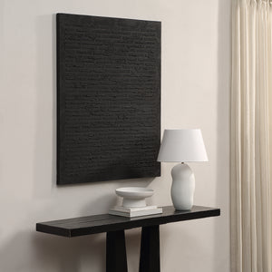 Kinetic canvas art by Renwil mounted on a wall above a console table with decor items.