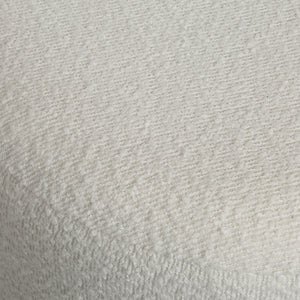 Chaves ottoman in textured white fabric, showcasing a soft, plush surface with a subtle pattern.