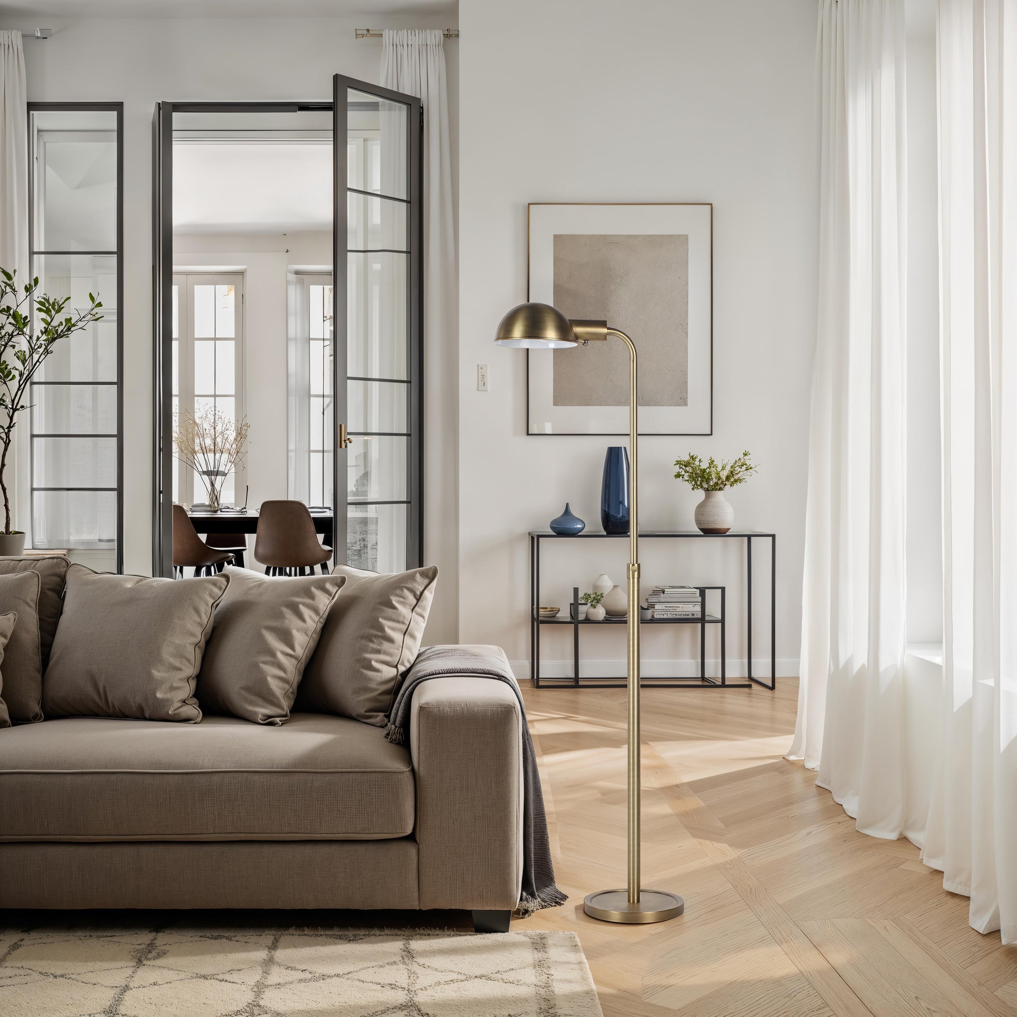 Cos floor lamp placed beside a sofa in a modern living room setting.