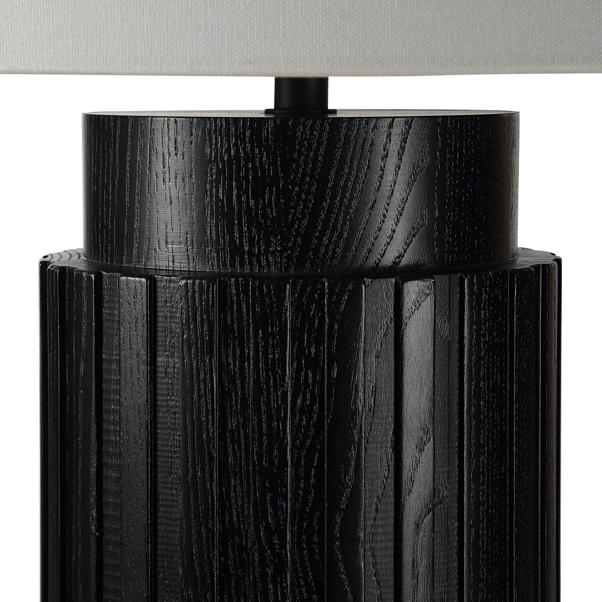 Close-up of Stilus Table Lamp showing black textured base and white shade