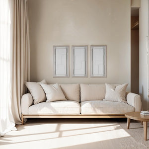 Arches wall art displayed above a light-colored sofa in a modern living room