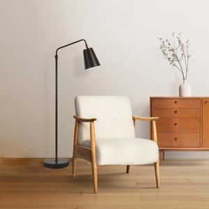 Nottingham floor lamp by Renwil beside a light-colored armchair in a modern setting