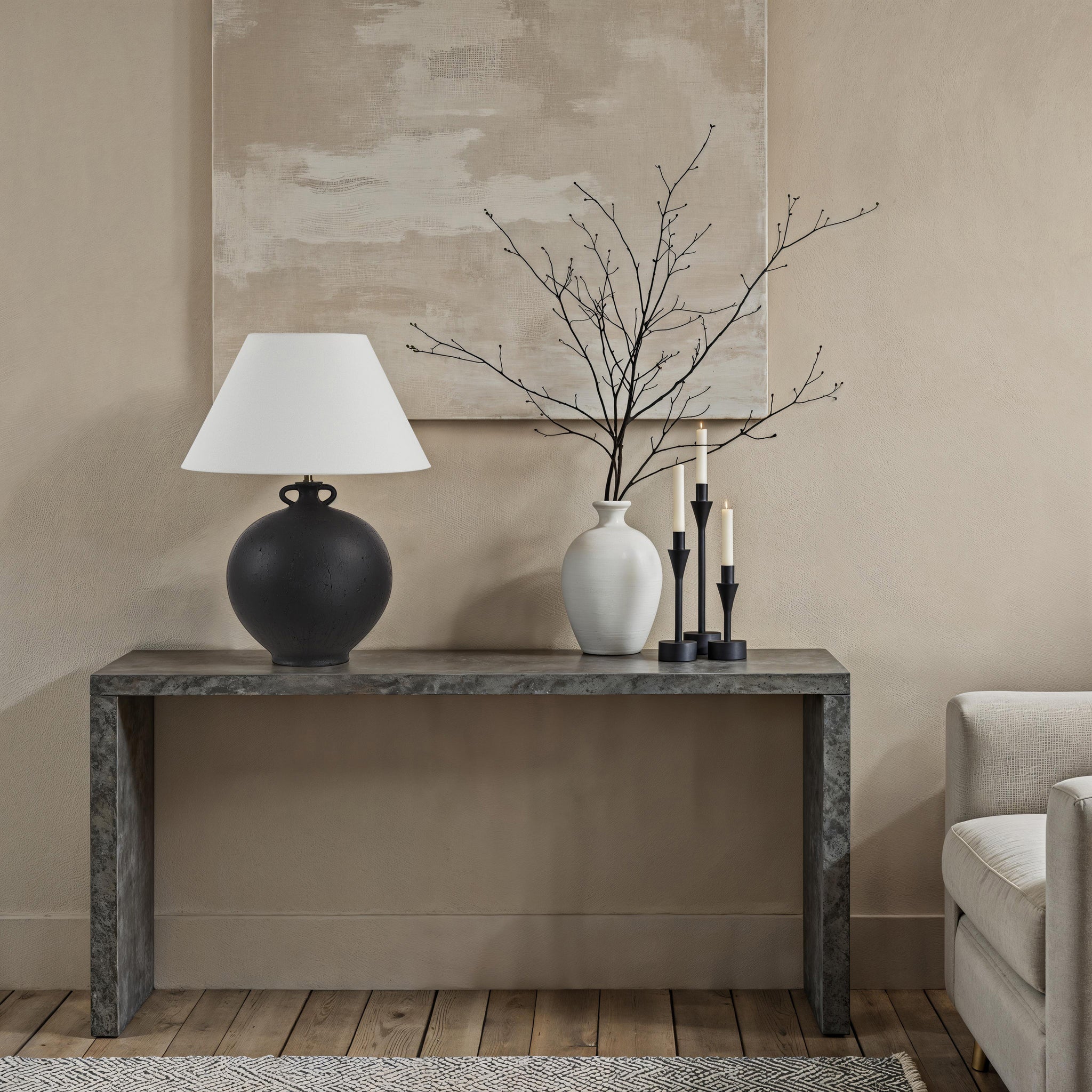 Alicia Table Lamp by Renwil, black ceramic base with white shade on a console table.