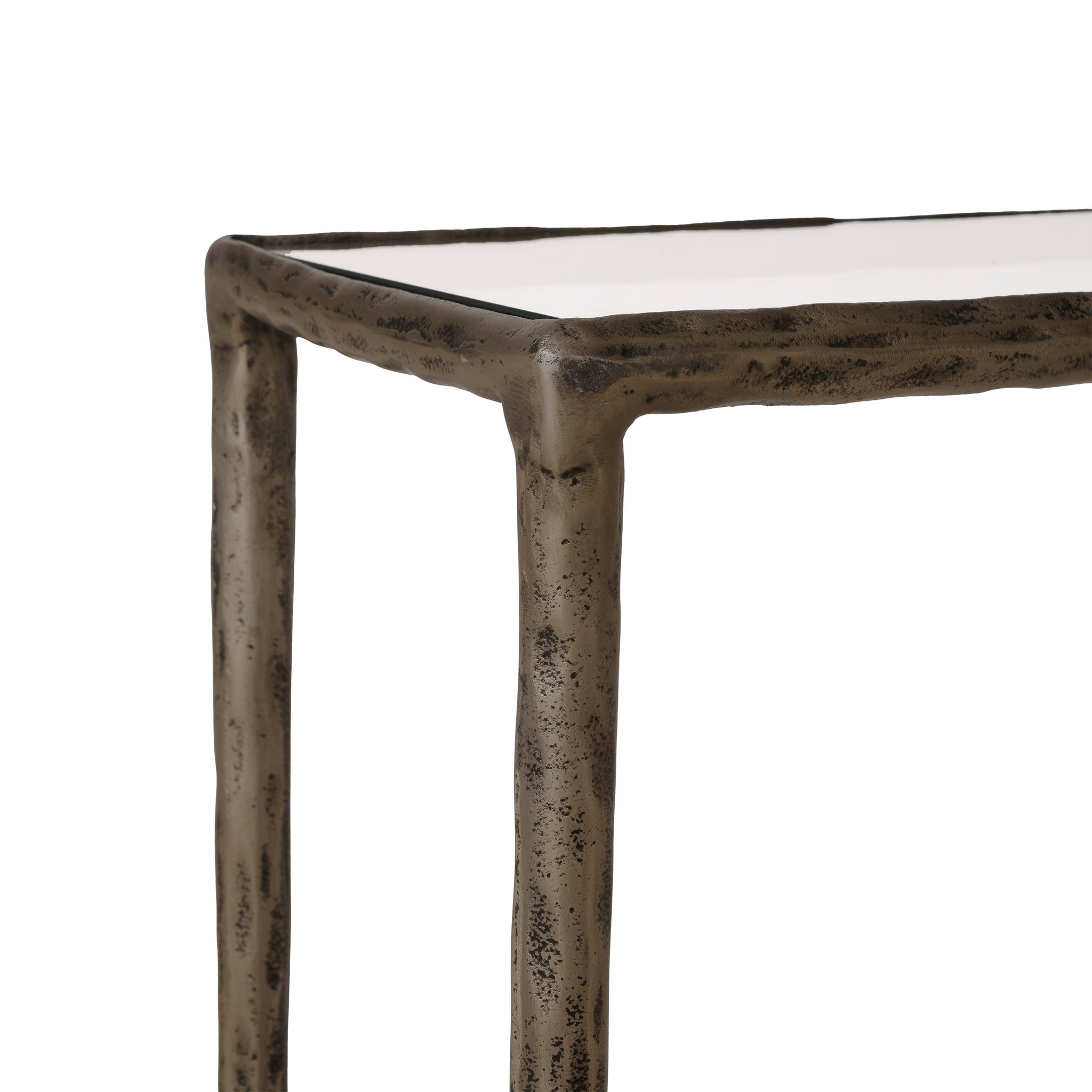 Nara console table featuring a white surface and bronze frame, close-up view of the corner.