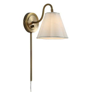 Arielle wall sconce showcasing a soft cream shade and brass arm, elegantly lit.