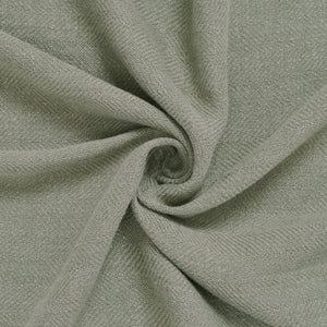 Pisces indoor pillow fabric in soft light green, displaying a smooth, woven texture.