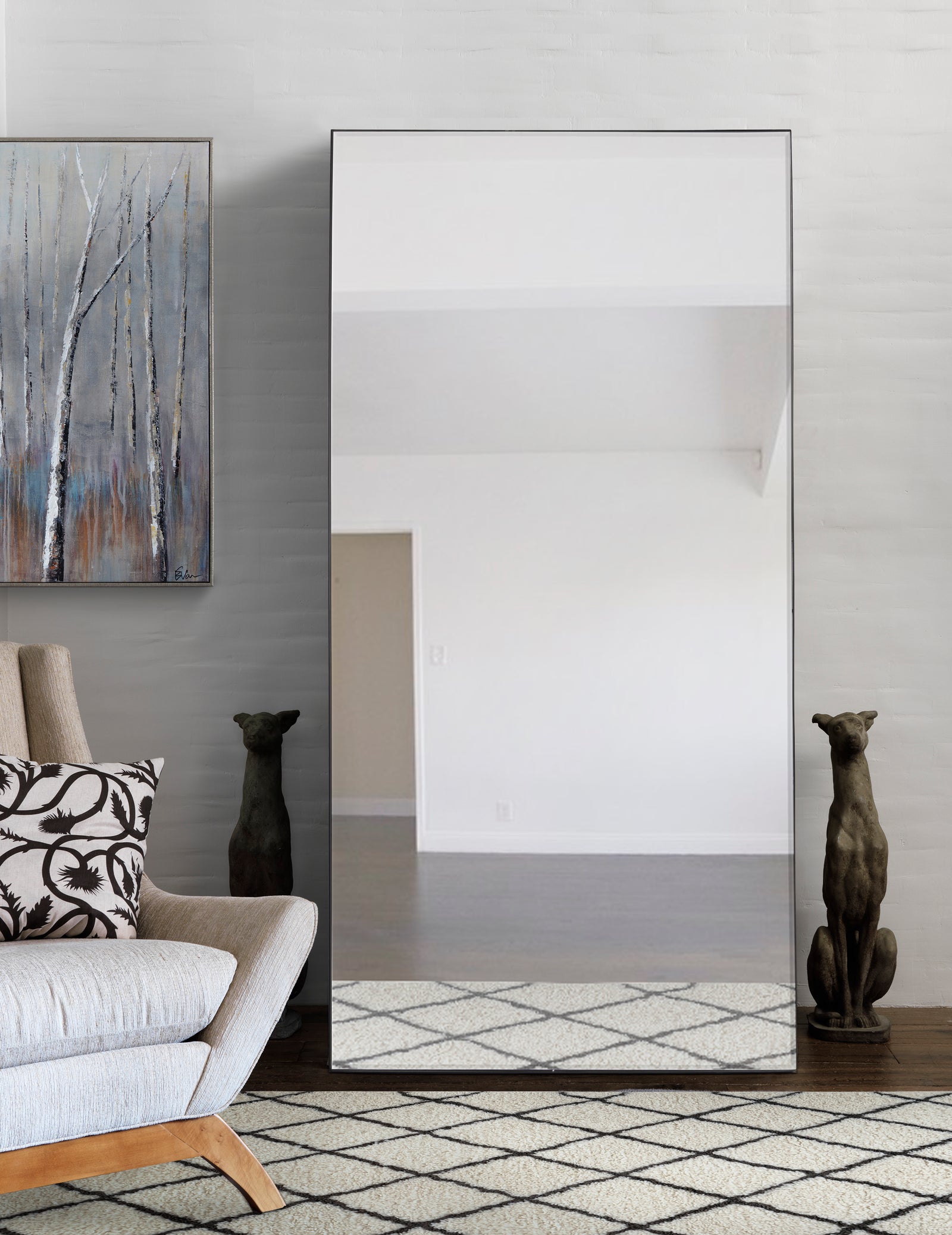Trilo Full Length Mirror with a sleek, curved design and a reflective surface.