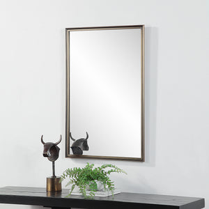 Sandcastle Wall Mirror displayed above a console table with decorative elements.