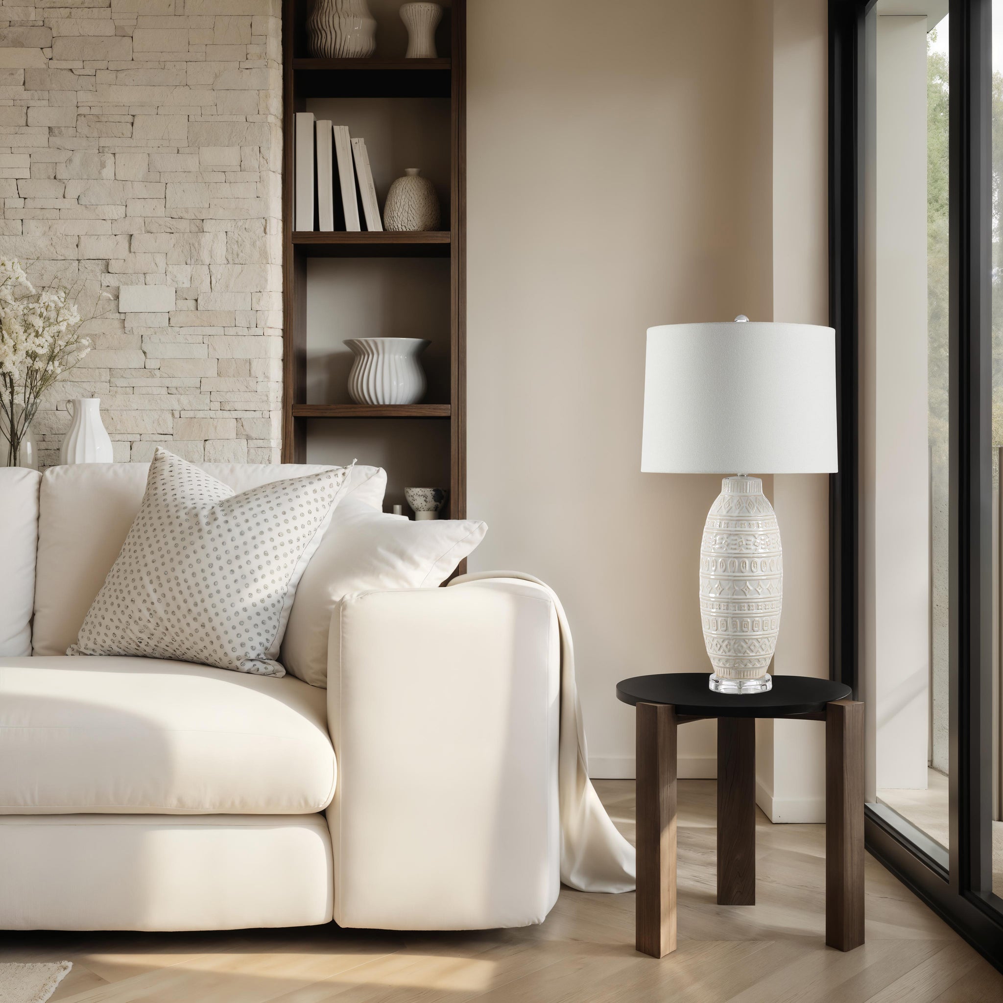 Sereno Table Lamp on a side table next to a white sofa in a stylish living room.