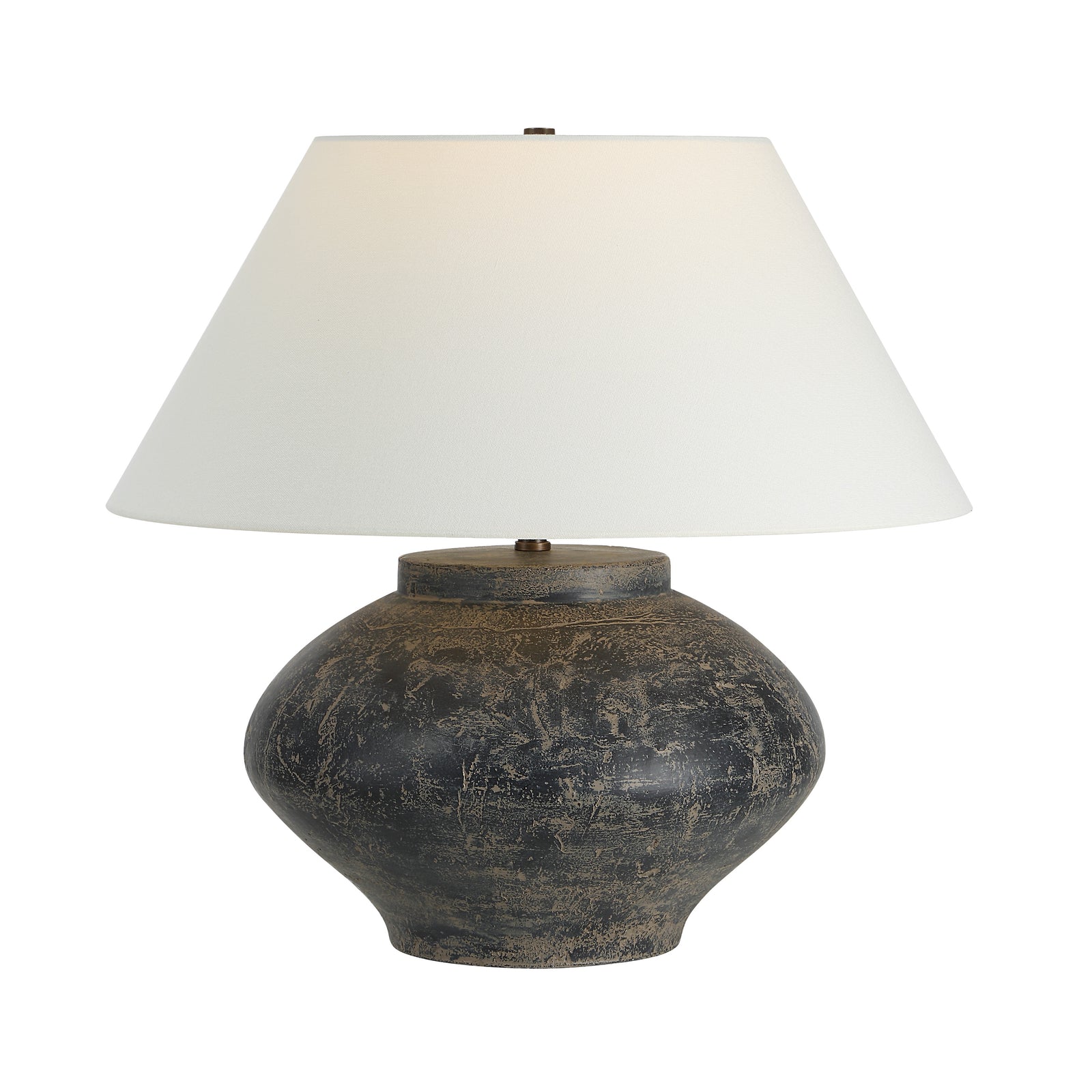 Patina table lamp with a round dark base and white fabric shade