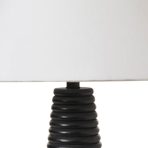 Kailua Table Lamp close-up of the black ribbed base and white shade.