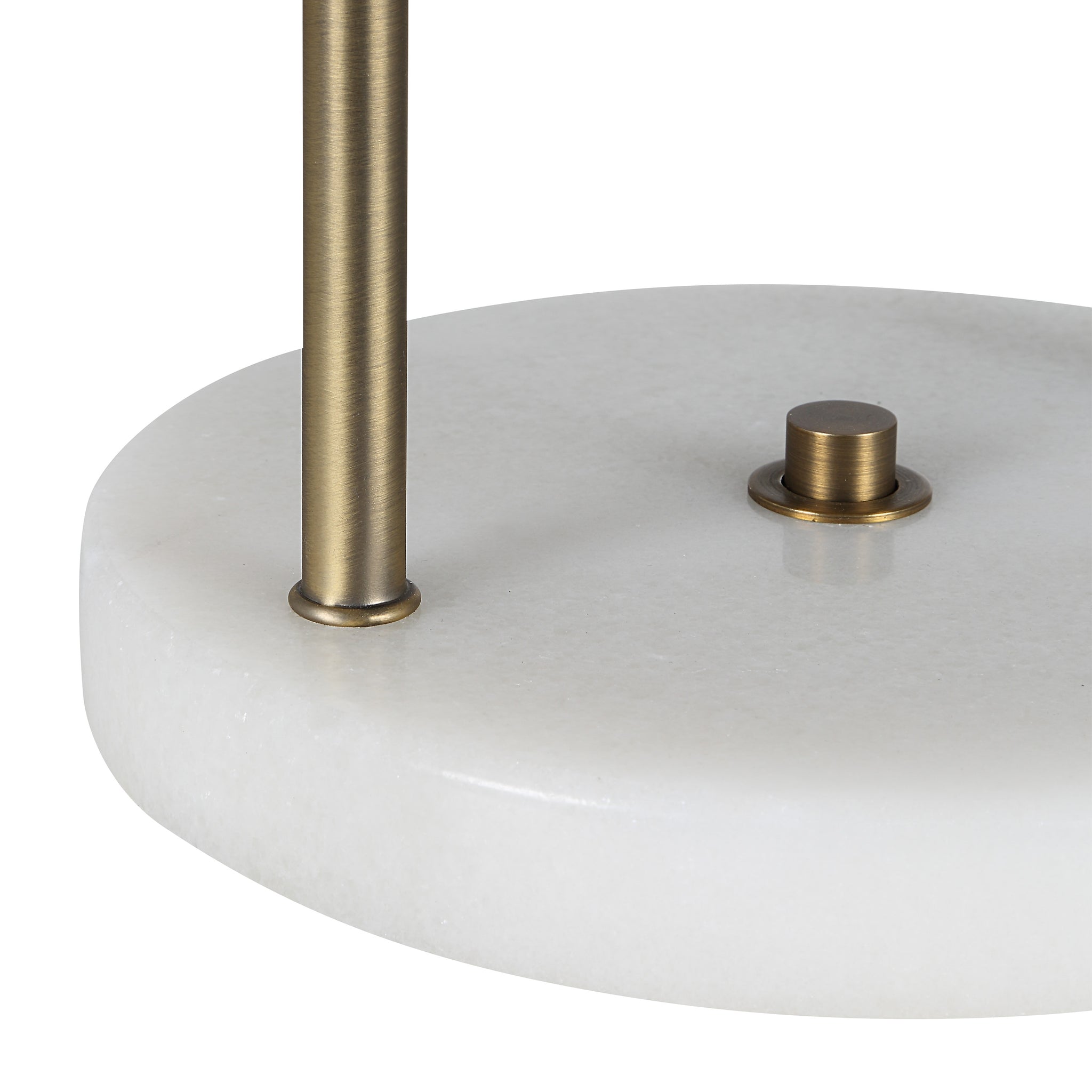 Close-up of the Barca table lamp's white marble base and brass detailing.