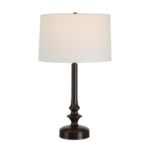 Zyra Table Lamp featuring a white shade and dark bronze base, lit, side view.