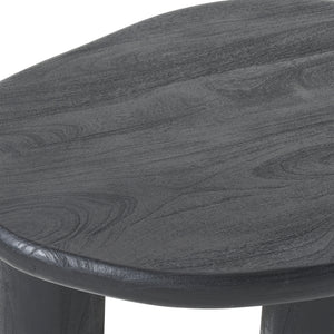 Close-up of Rowe table's textured black surface and rounded edges