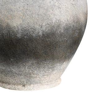 Close-up of Betulla Table Lamp's gray ceramic base showcasing a textured finish.