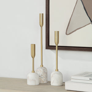 Marchesa Set of 3 Tapered Candle Holders displayed on a shelf with artwork in the background