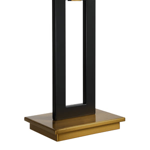 Close-up of Lila Table Lamp's black base and gold square platform.