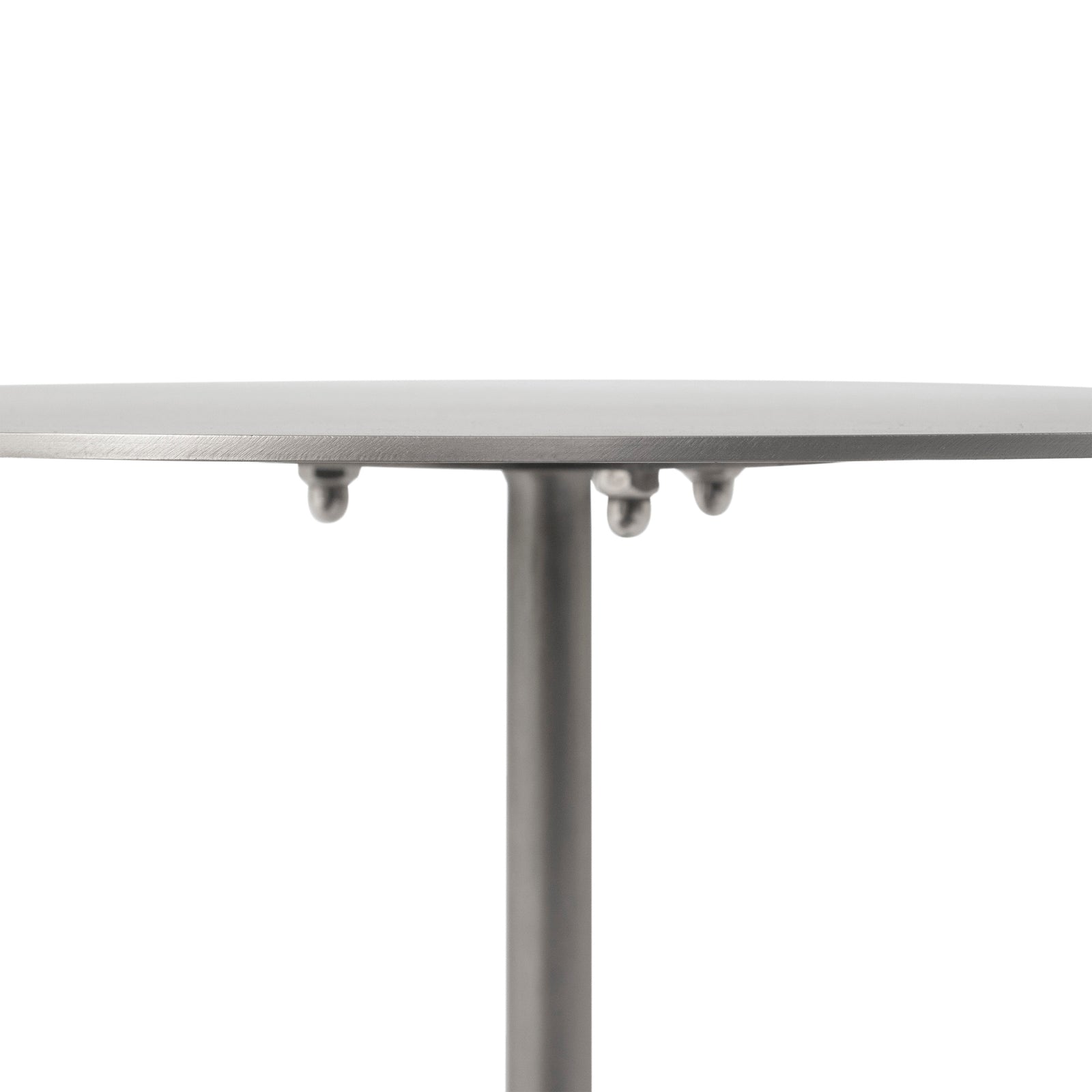 Aiden side table featuring a round metal top and a marble base in gray and white.