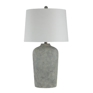 Aurelle table lamp with a textured gray ceramic base and a white fabric shade.