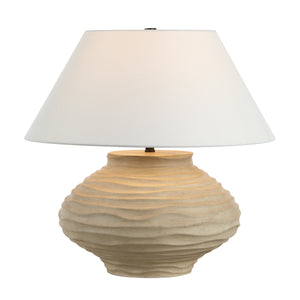 Ola table lamp by Renwil featuring a warm beige base and white shade illuminated