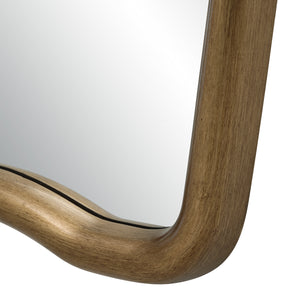 Close-up of Echoa mirror's gold frame with a smooth finish and reflective surface.