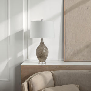 Vienne Table Lamp on a modern console table beside a beige sofa.