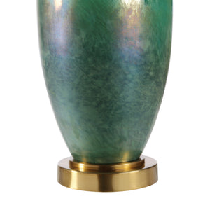 Close-up of Wave table lamp base featuring a green iridescent glass finish with a gold base