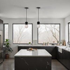 Stylish kitchen featuring two Solene pendant lights and large windows with greenery