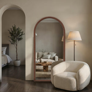 Madiwell mirror in a stylish interior setting, reflecting a cozy living room scene.