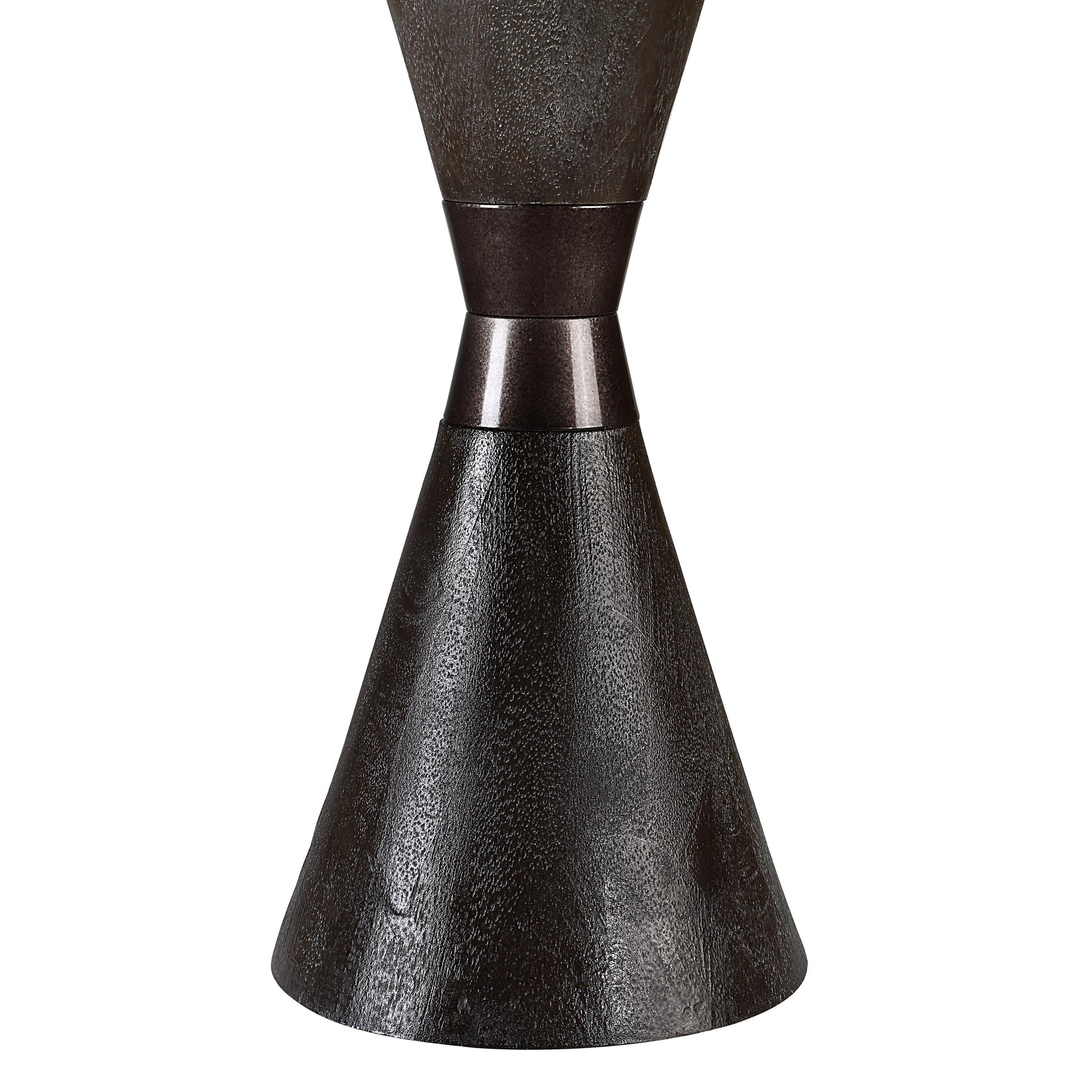 Close-up of Vyara table lamp's dark textured base and metal accent