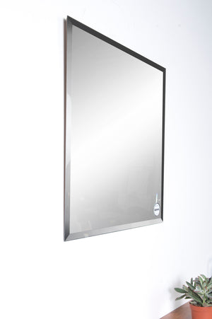 Vogue Wall Mirror featuring a rectangular shape with a black frame, angled view.