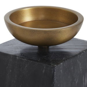 Poema candle holder featuring a round bronze bowl atop a black marble base, showcasing a modern design.