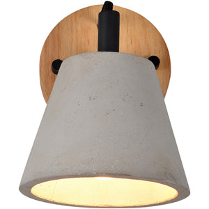 Turtle Bay Wall Sconce displaying a gray concrete shade with light shining through, mounted on a wood backplate.