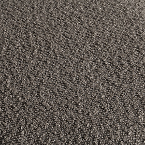 Close-up view of Amarion stool's dark gray fabric texture, showcasing its unique surface pattern