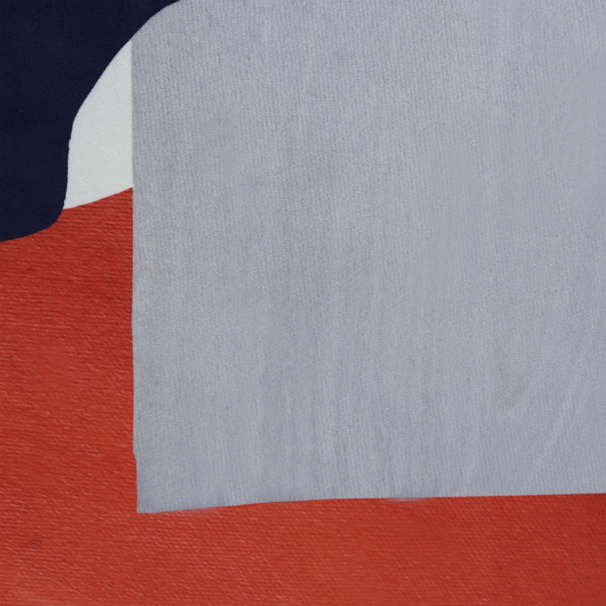 Close-up of Lonzo Indoor Pillow showing abstract shapes in navy, gray, and red.