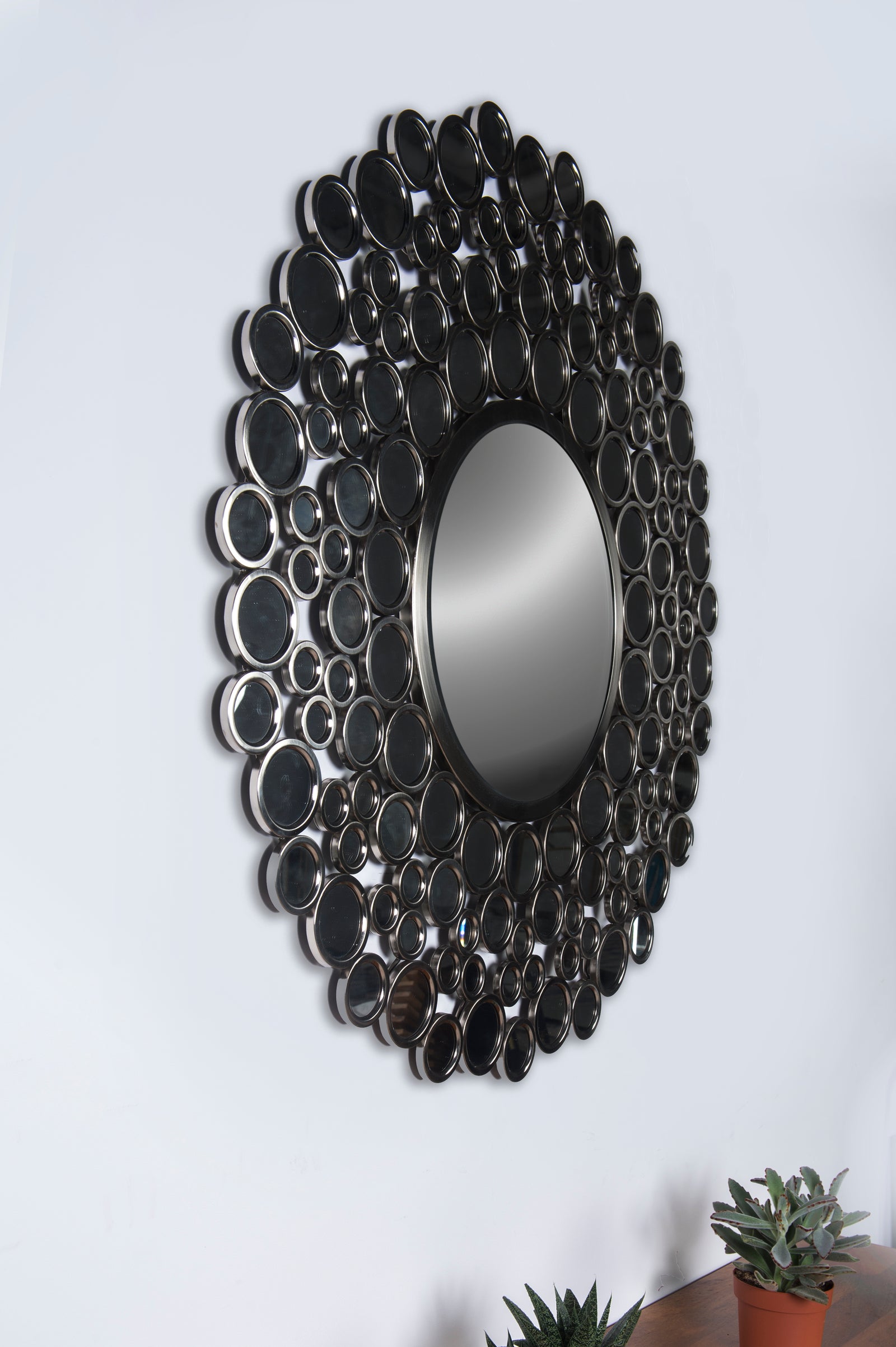 Andromeda Wall Mirror featuring a round design with circular mirrors in a silver finish.