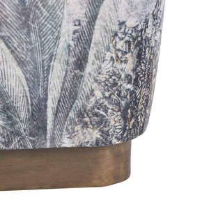 Side view of Tangle Ottoman, displaying detailed botanical print and wooden base.