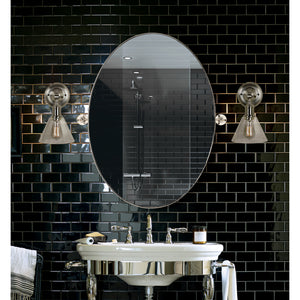 Azalea Wall Mirror installed in a modern bathroom with black tile backdrop
