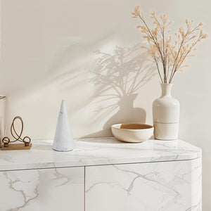 Silica statue by Renwil on a marble surface with decorative items and dried flowers.