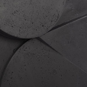 Close-up of Mura wall decor highlighting the textured surface and geometric details in dark gray.