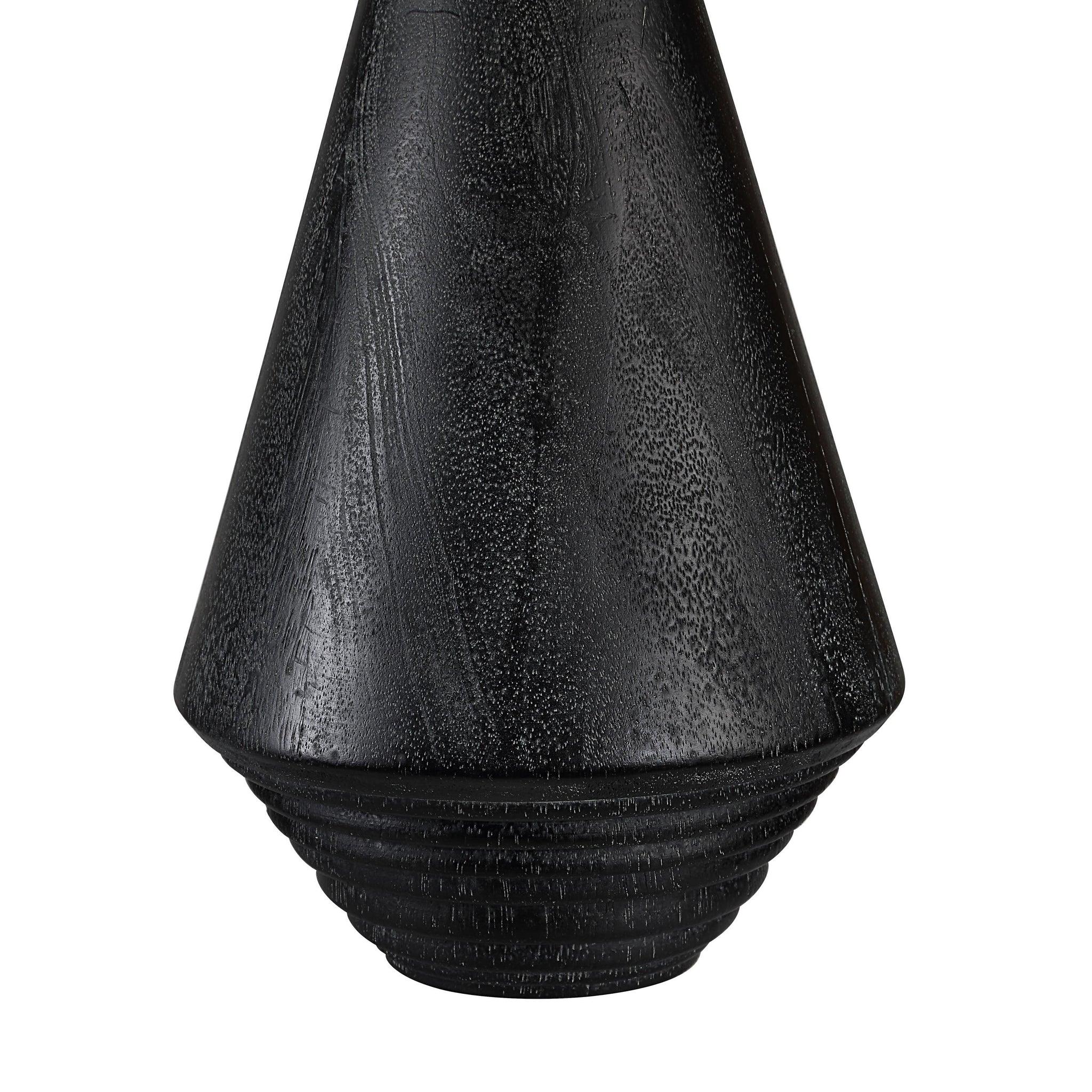 Close-up of Tortora Table Lamp's black textured base with ribbed details.