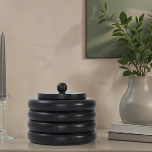 Cipher bookends by Renwil displayed on a shelf with plants and decor.
