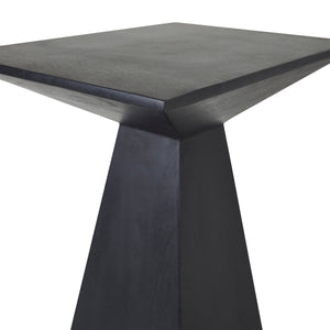 Close-up of the Moulin Side Table in black, highlighting its sharp edges and smooth surface.