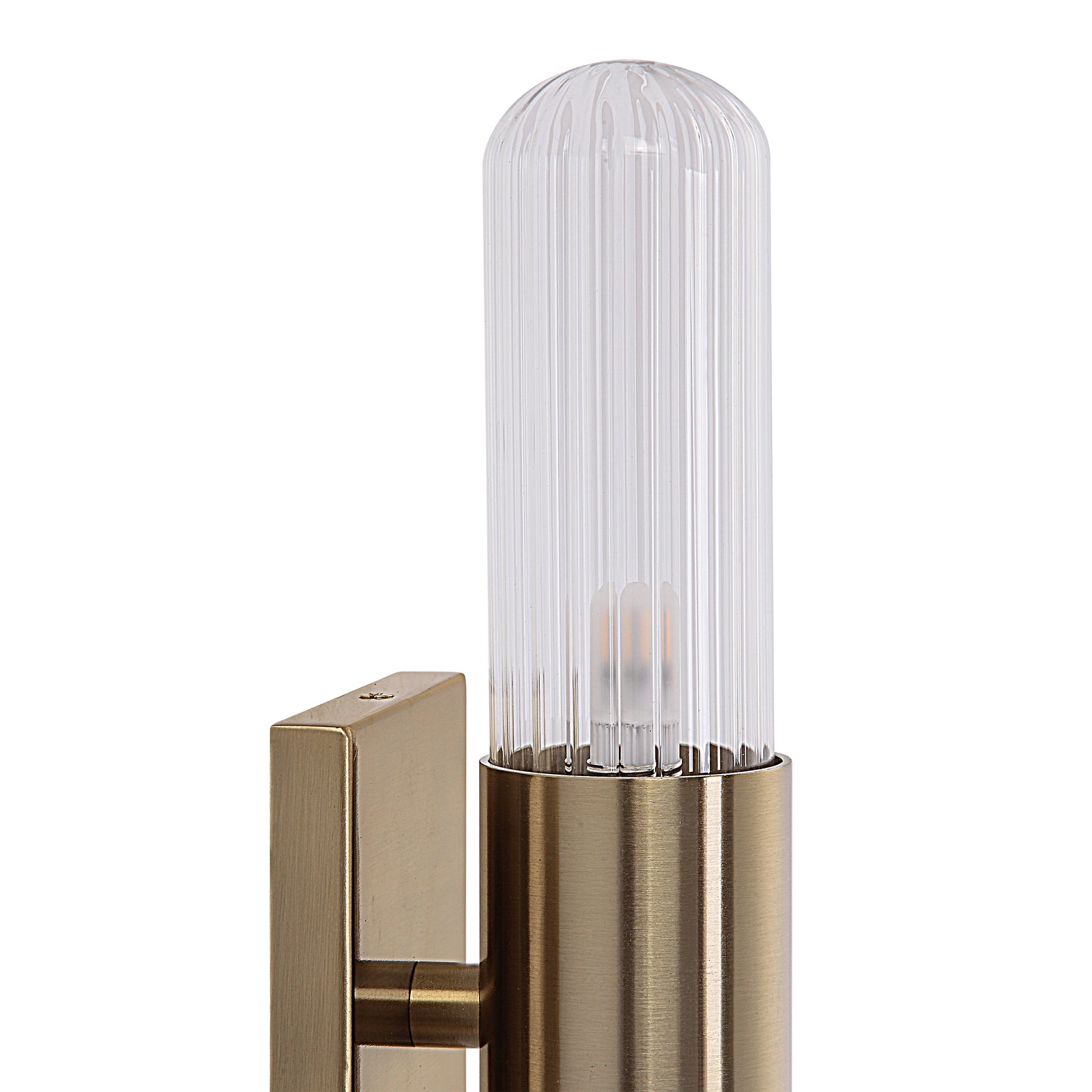 Chiara Wall Sconce with clear ribbed glass shade and brass base, side view
