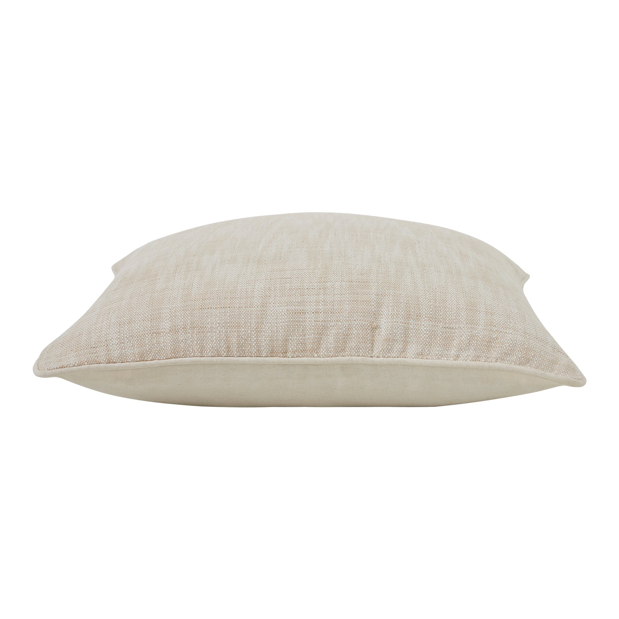 Side view of Amal indoor pillow highlighting its soft, light beige fabric.