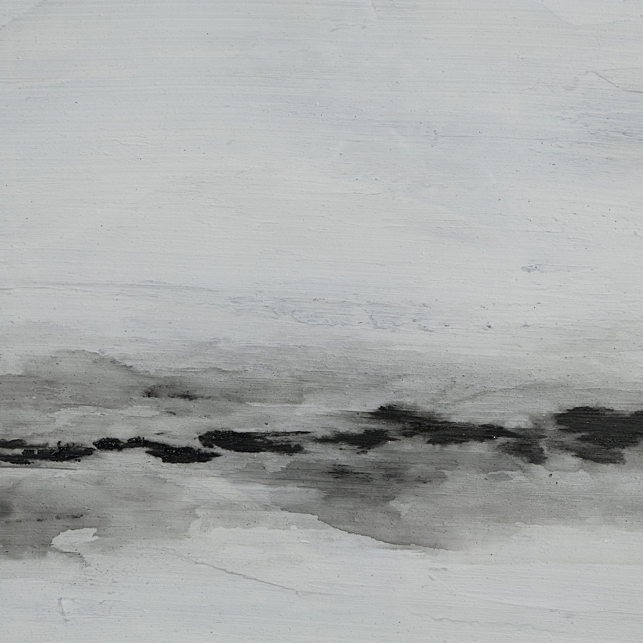 Close-up of a black and white abstract painting with soft brush strokes.