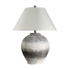 Betulla Table Lamp with a textured gray ceramic base and white fabric shade.